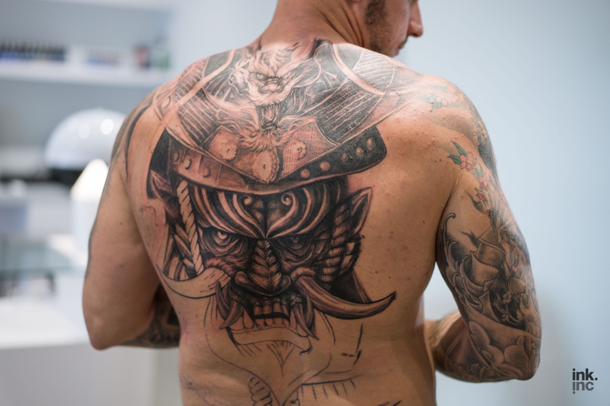 Man with a large custom tattoo on his back.