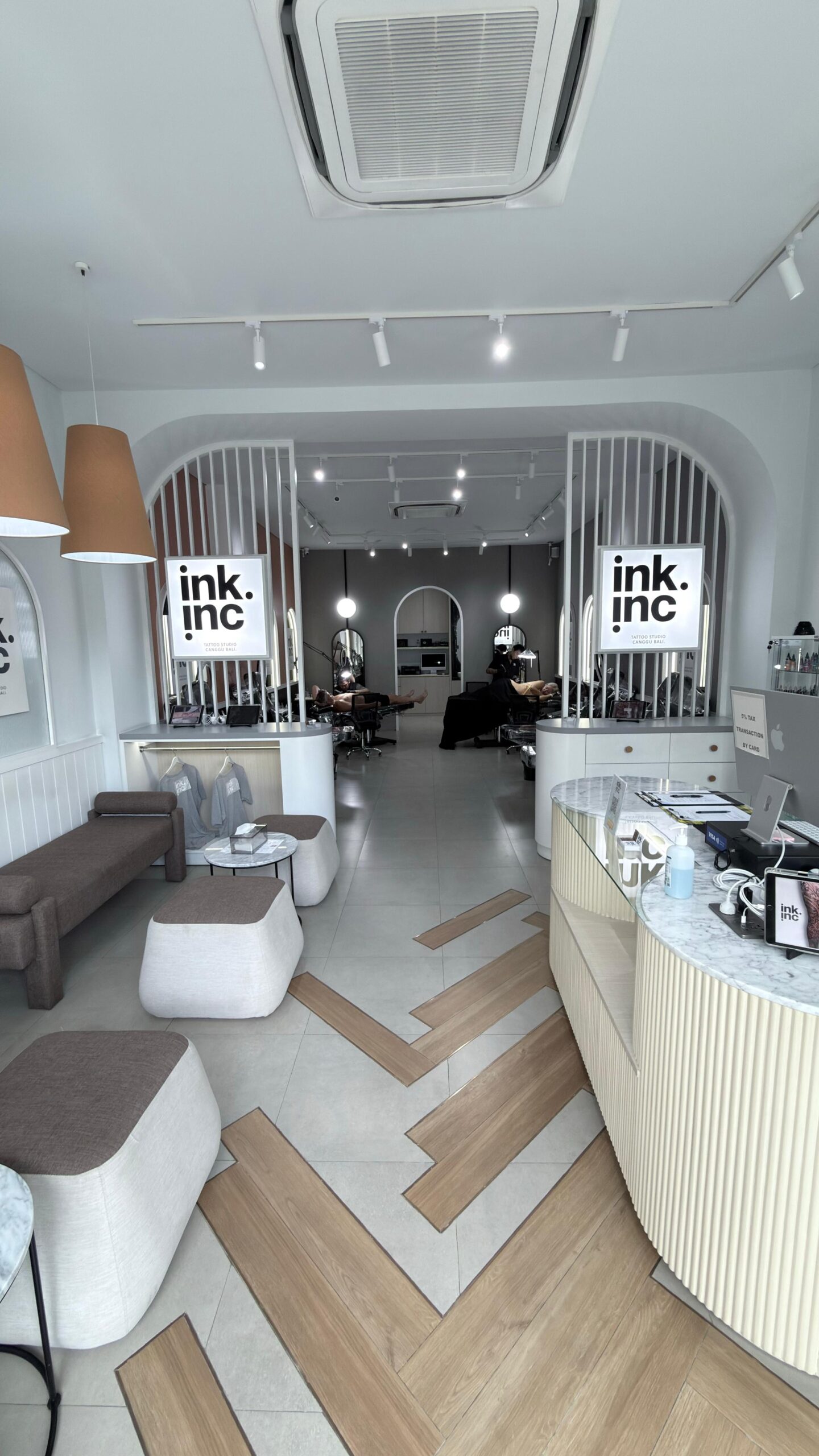 Clean and sterile tattoo station with a modern black chair.